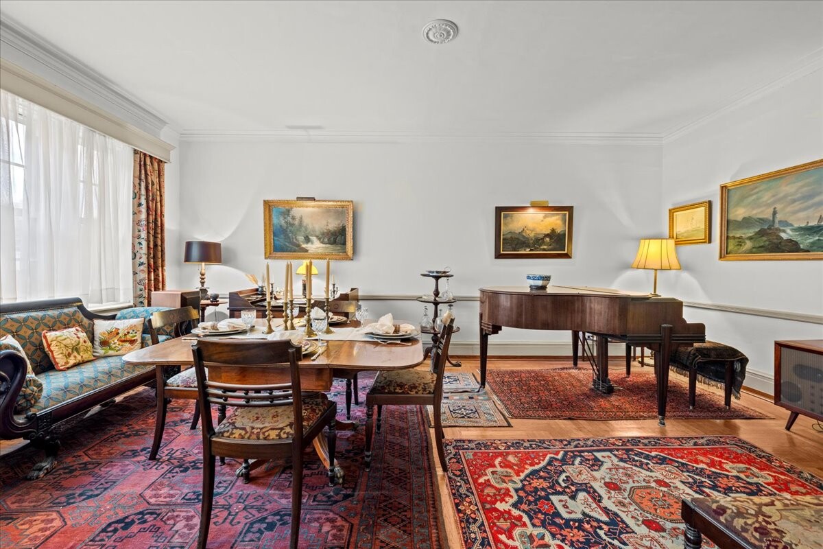 525 West 238th Street, Unit 2B Bronx, NY 10463 - Photo 7 of 31 a living room with furniture and a rug