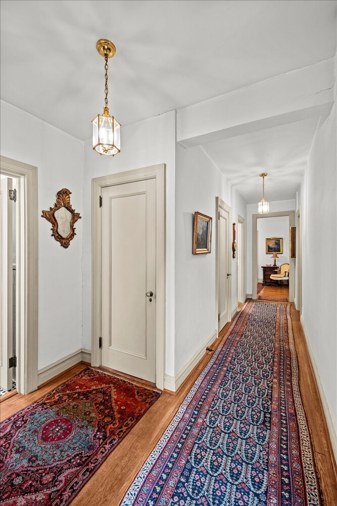 525 West 238th Street, Unit 2B Bronx, NY 10463 - Photo 9 of 31 a view of a hallway view with wooden floor and rug