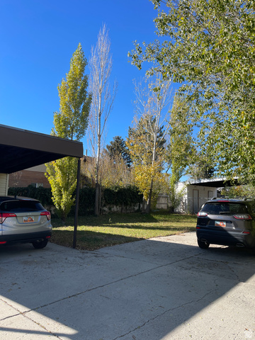 3977 Rivendell Road, Unit AB Taylorsville, UT 84129 - Photo 13 of 14 View of vehicle parking with concrete driveway