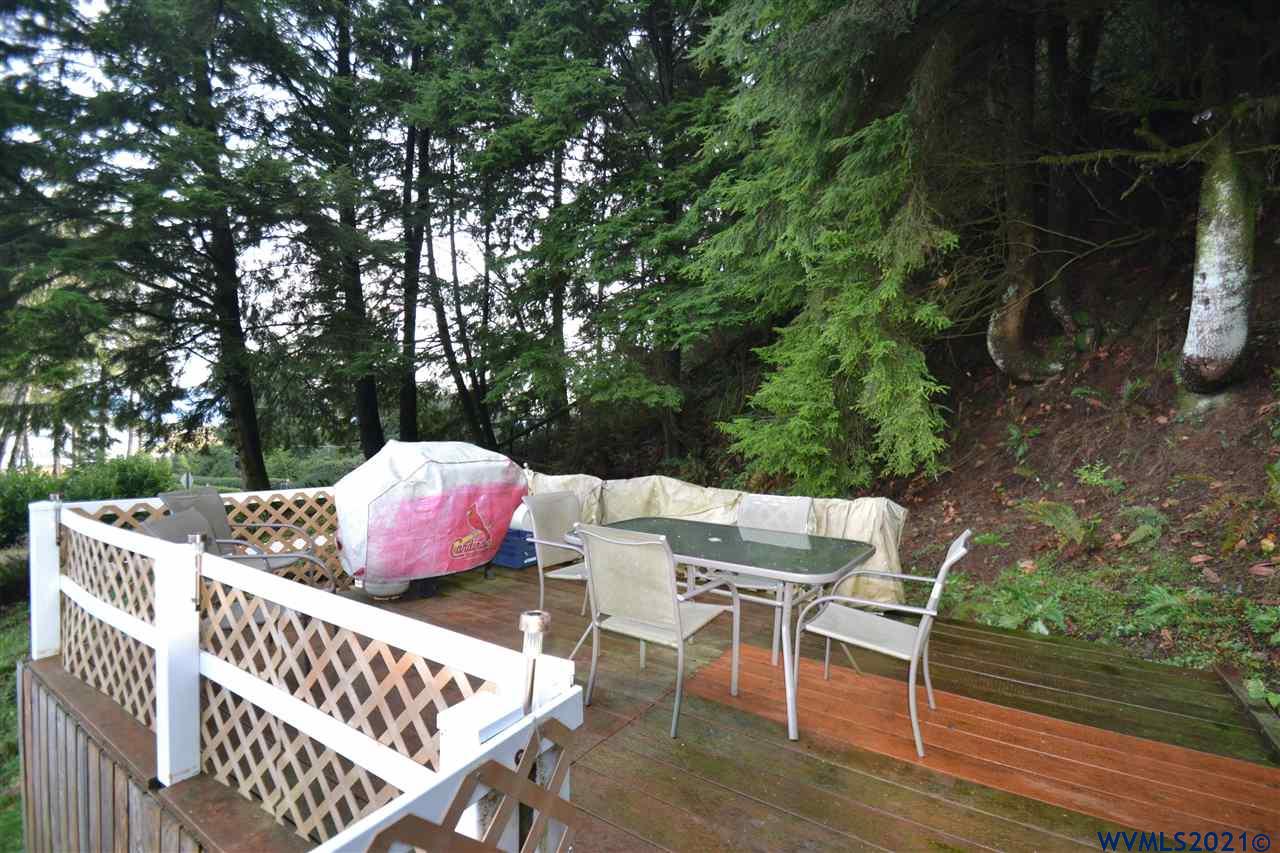 1690 Bayocean Road Northwest Tillamook, OR 97141 - Photo 18 of 25 a view of a chairs and table in the patio
