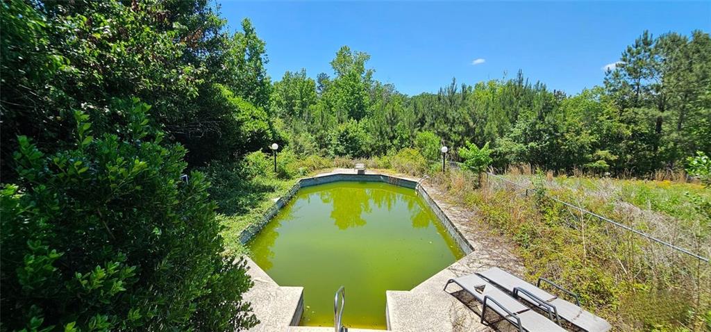 944 Lite-N-Tie Road Macon, GA 31211 - Photo 29 of 36 a view of swimming pool with a garden