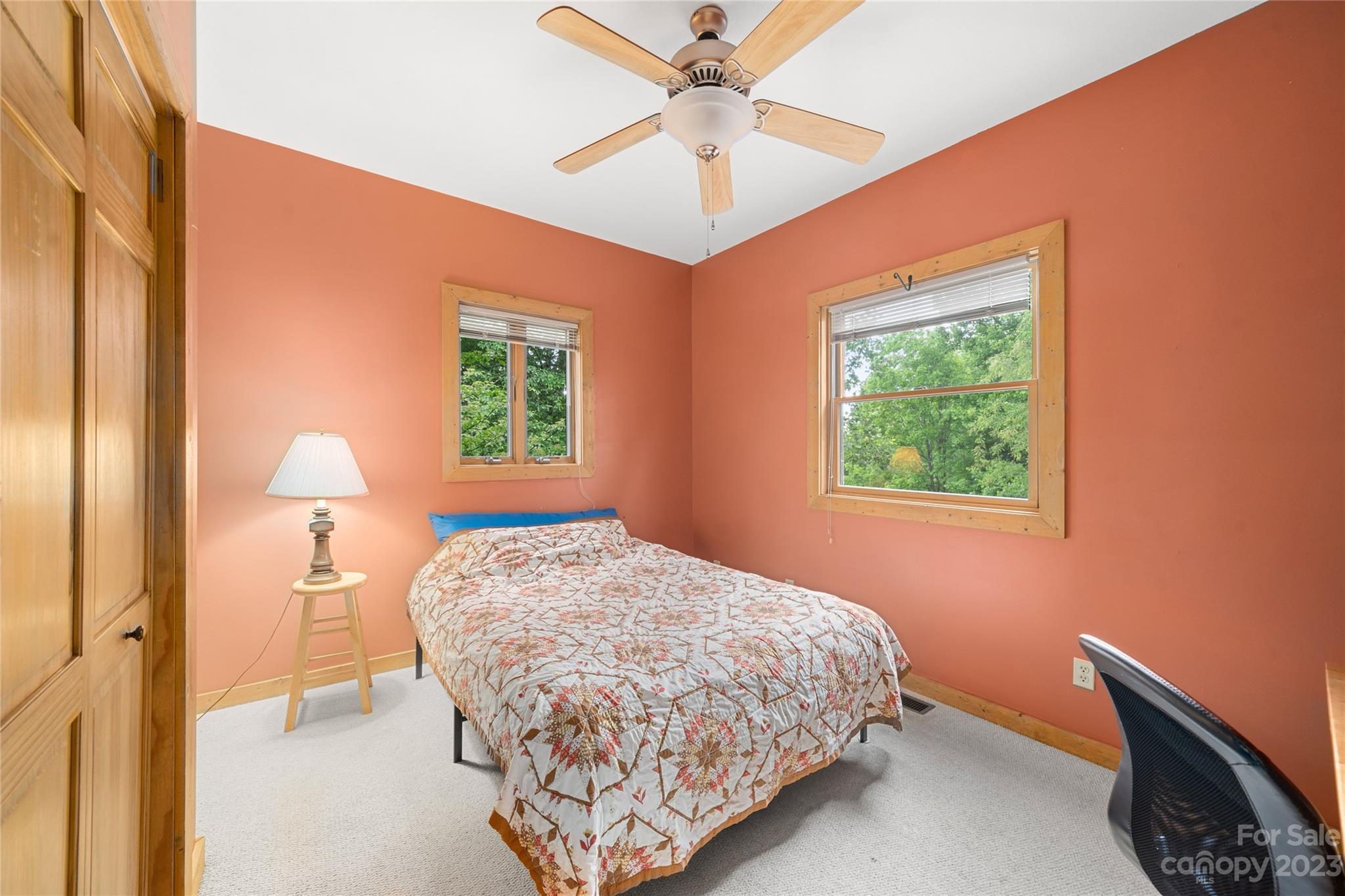 193 Eagle Ridge Clyde, NC 28721 - Photo 16 of 48 a bedroom with a bed and a window