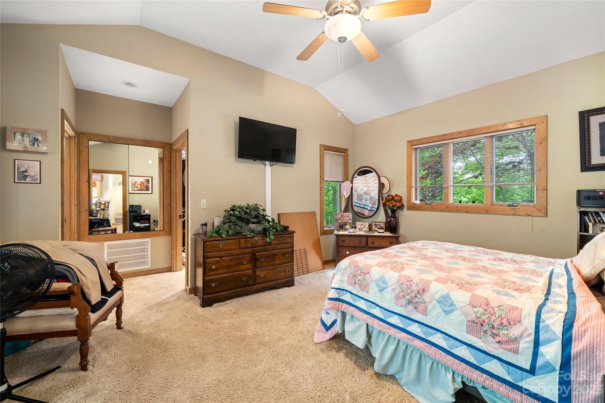 193 Eagle Ridge Clyde, NC 28721 - Photo 18 of 48 a bed room with a bed and a television