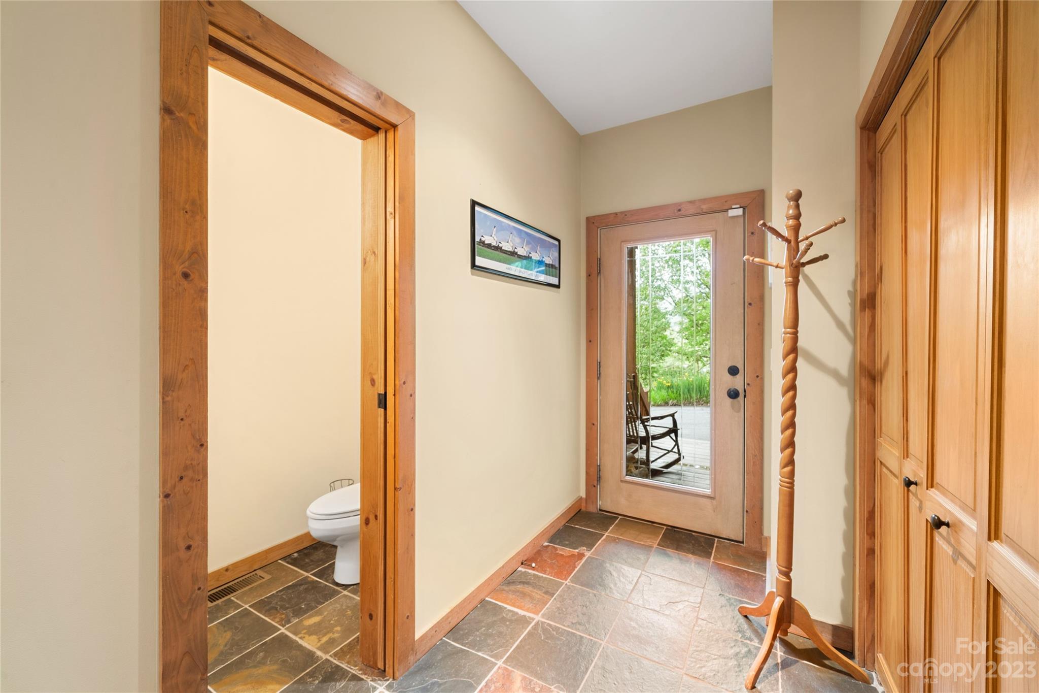 193 Eagle Ridge Clyde, NC 28721 - Photo 2 of 48 a view of an entryway with wooden floor and a livingroom