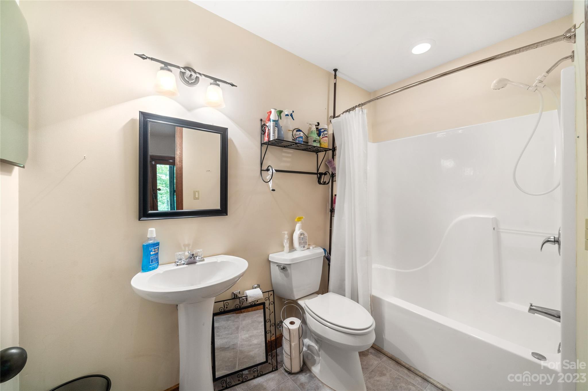 193 Eagle Ridge Clyde, NC 28721 - Photo 28 of 48 a bathroom with a sink toilet and shower