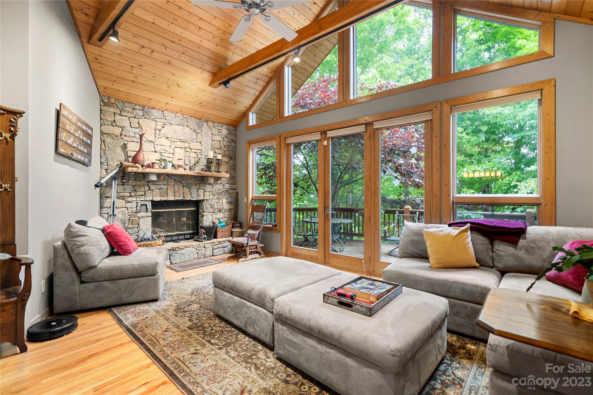 193 Eagle Ridge Clyde, NC 28721 - Photo 3 of 48 a living room with furniture a fireplace and a large window