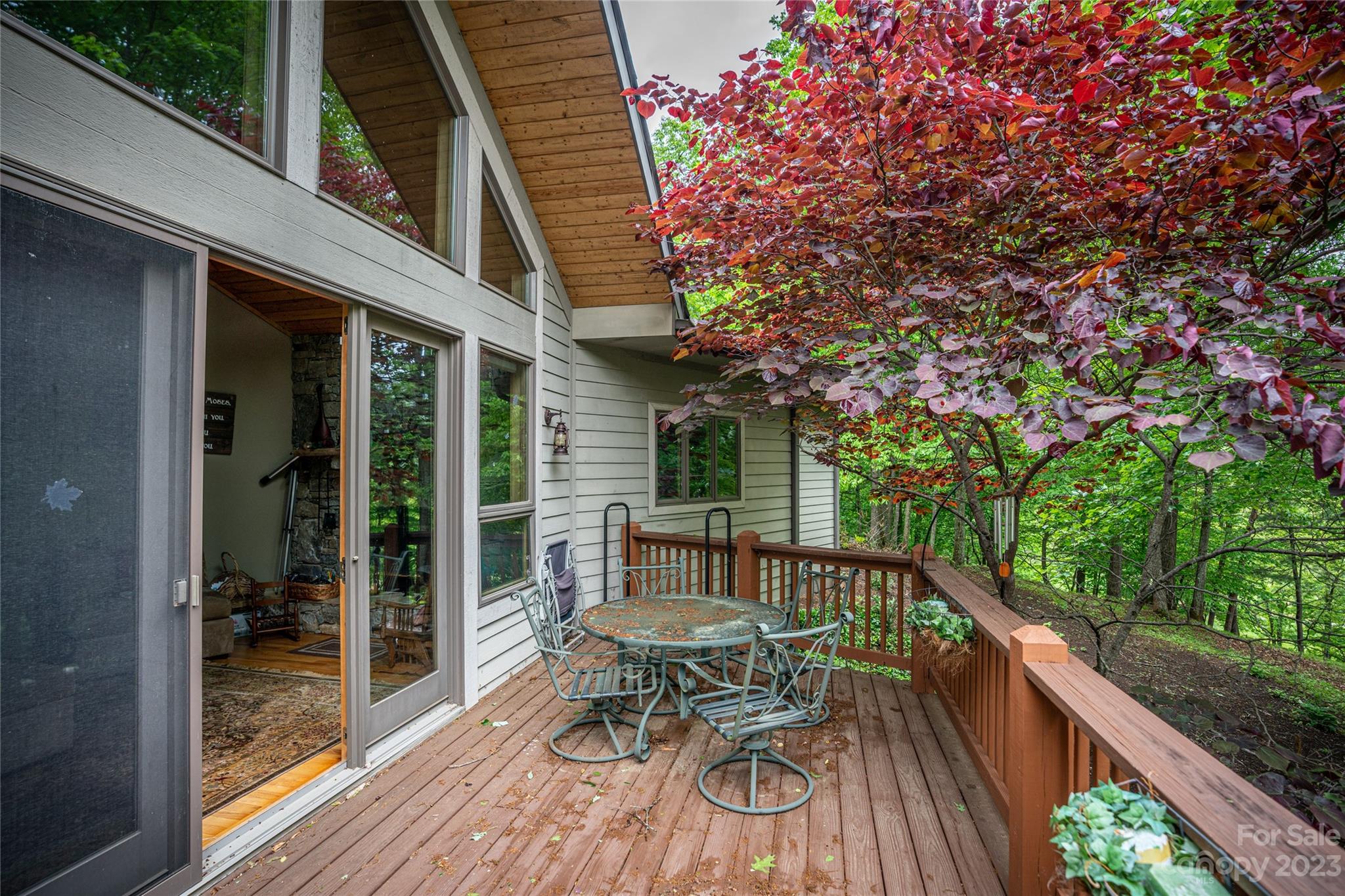 193 Eagle Ridge Clyde, NC 28721 - Photo 32 of 48 a balcony with wooden floor table and chairs