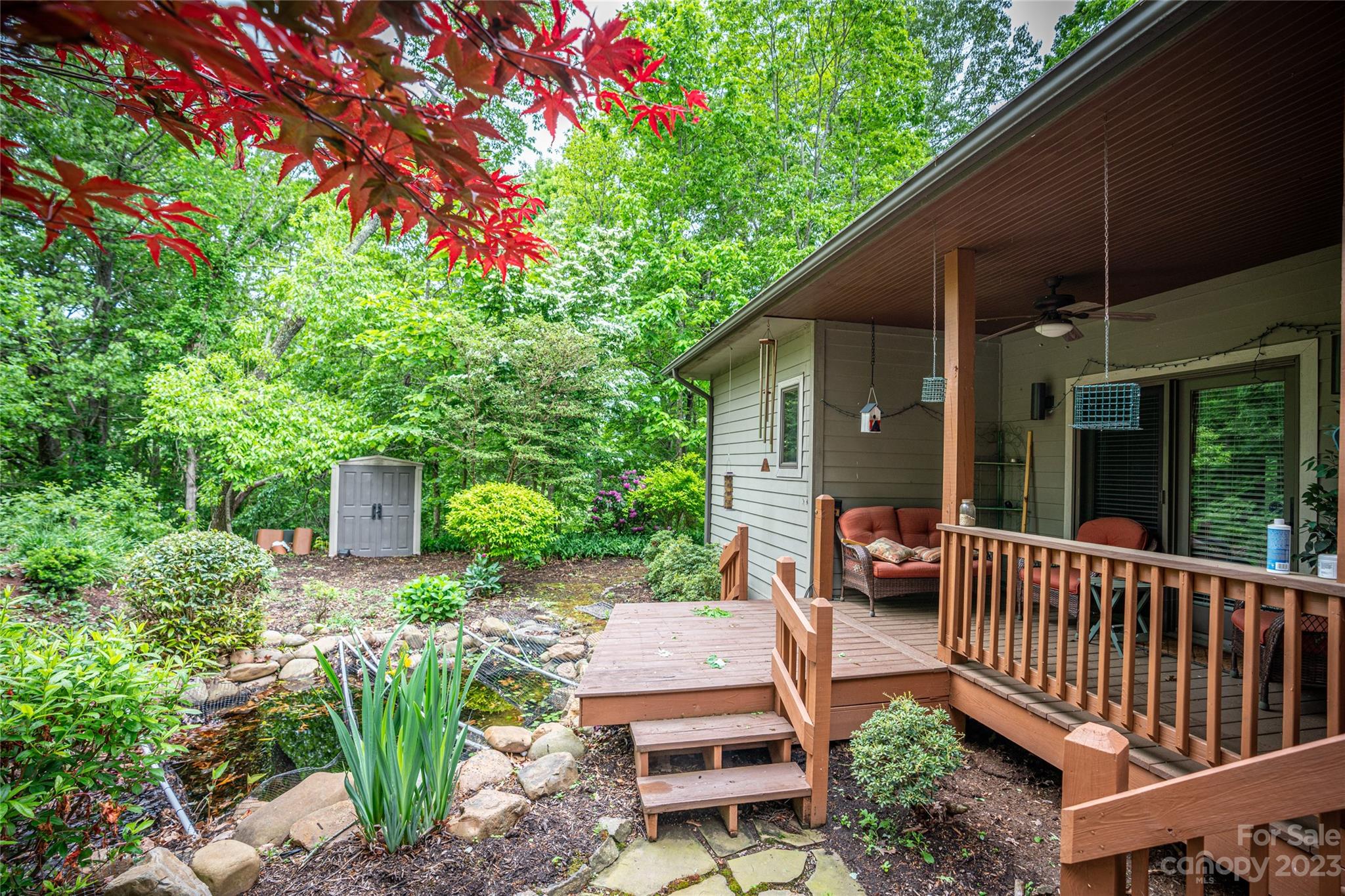 193 Eagle Ridge Clyde, NC 28721 - Photo 35 of 48 a view of a chair and table in backyard of the house