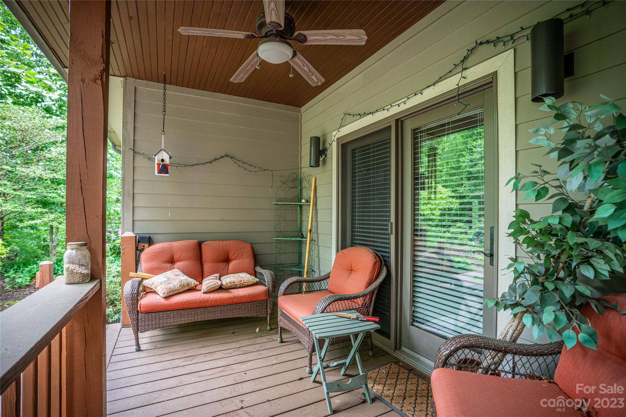 193 Eagle Ridge Clyde, NC 28721 - Photo 37 of 48 a outdoor space with patio the couches and a potted plant on a wooden floor
