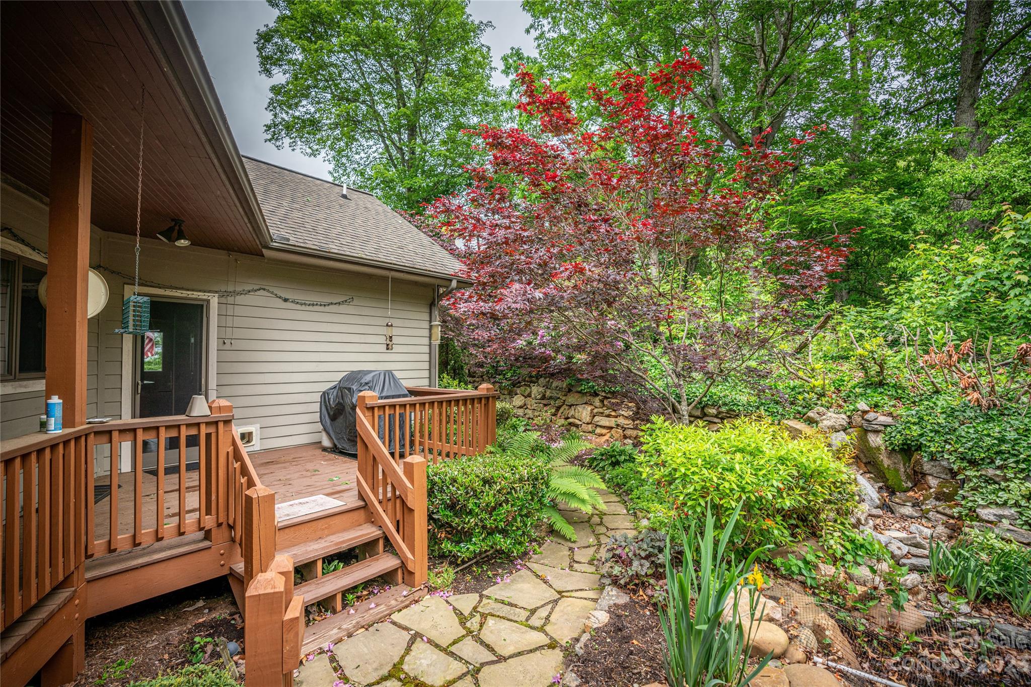 193 Eagle Ridge Clyde, NC 28721 - Photo 38 of 48 a view of a chair and table in the backyard
