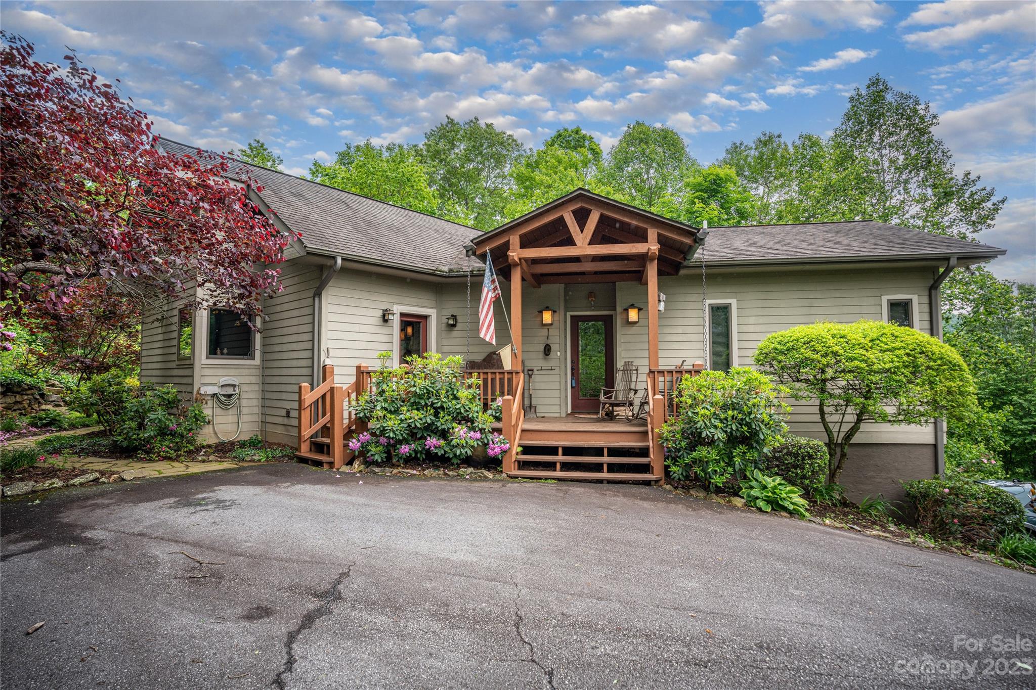 193 Eagle Ridge Clyde, NC 28721 - Photo 40 of 48 a front view of a house with a yard