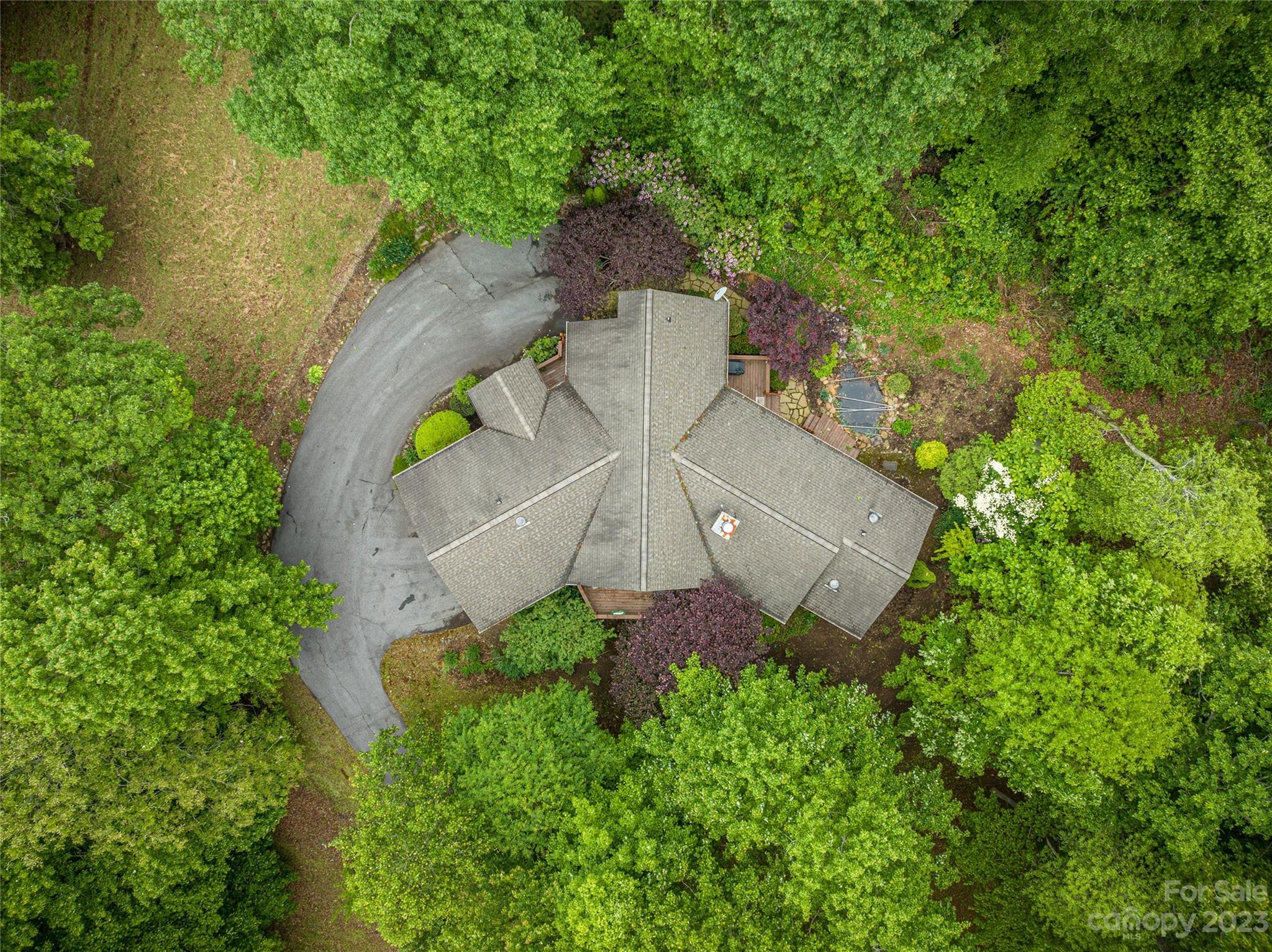 193 Eagle Ridge Clyde, NC 28721 - Photo 45 of 48 an aerial view of a house with a yard and trees
