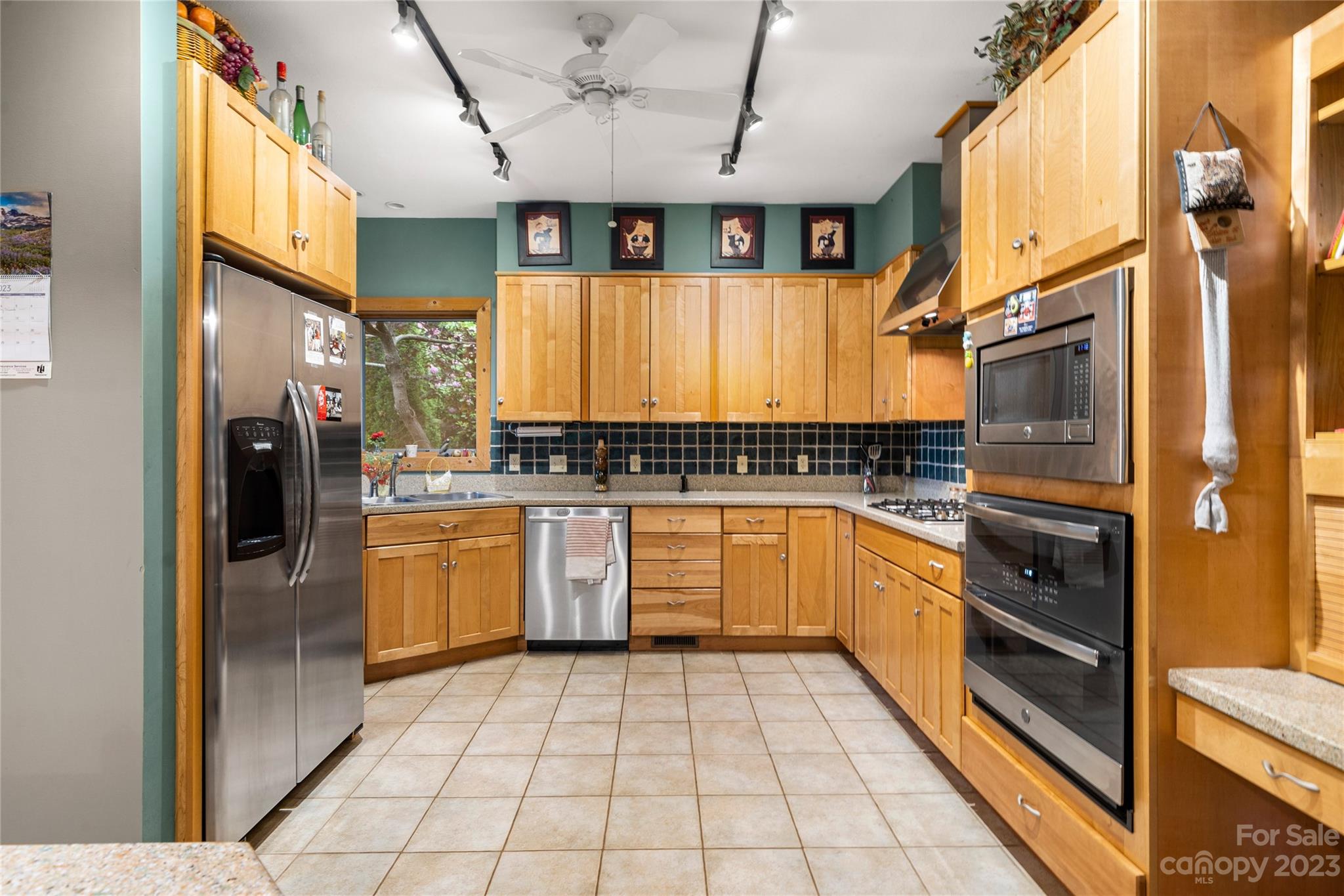 193 Eagle Ridge Clyde, NC 28721 - Photo 9 of 48 a kitchen with stainless steel appliances granite countertop a refrigerator a sink and dishwasher