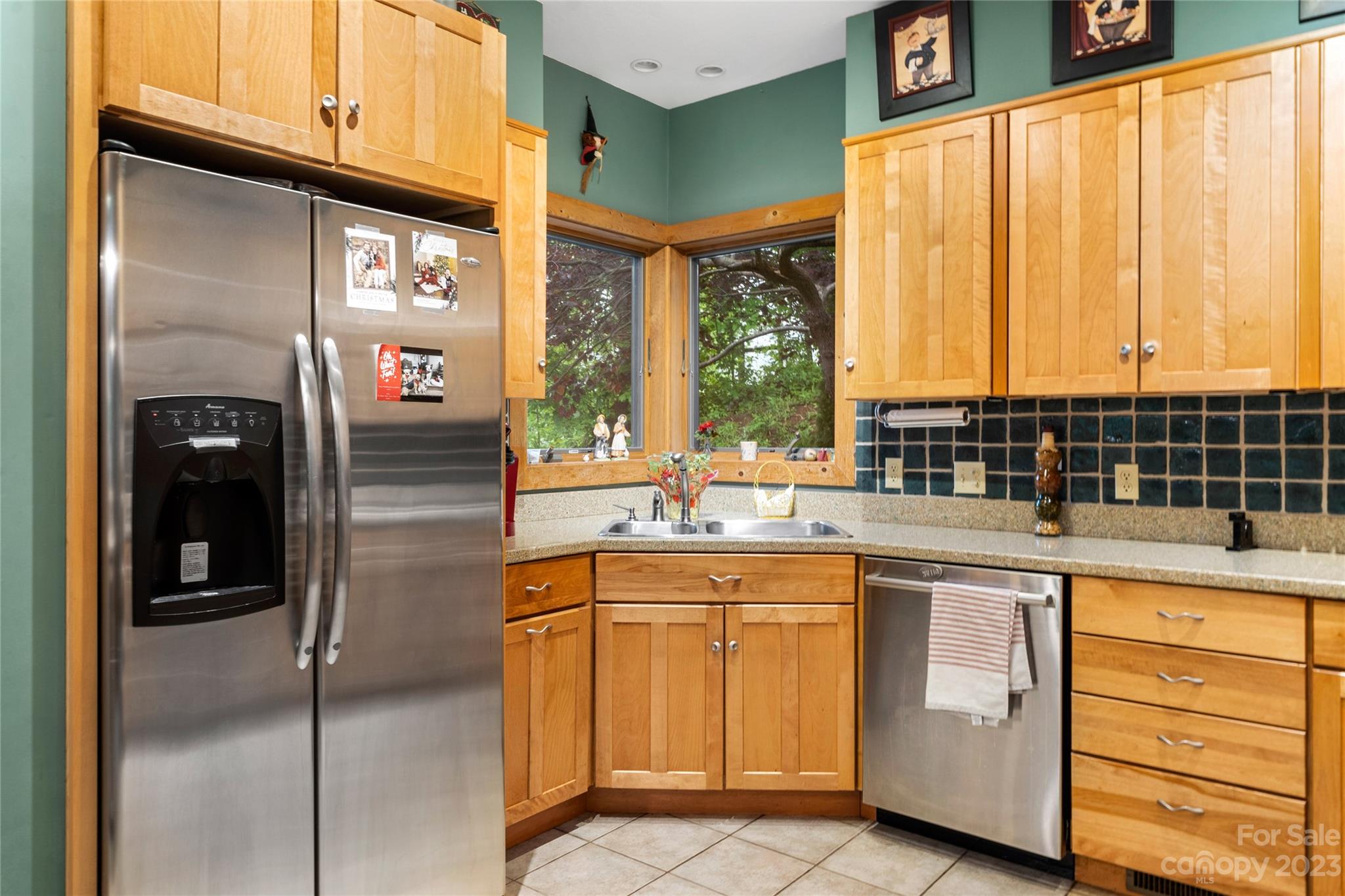 193 Eagle Ridge Clyde, NC 28721 - Photo 10 of 48 a kitchen with stainless steel appliances granite countertop a refrigerator and a sink