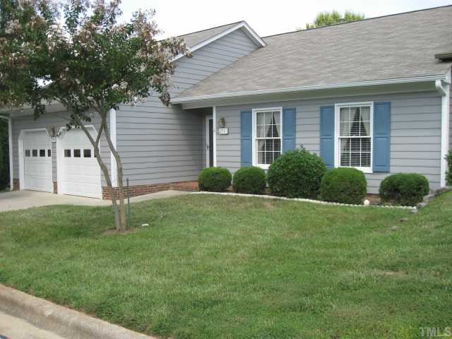 a house that is sitting in the grass