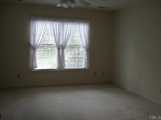 2701 Cottage Circle Raleigh, NC 27613 - Photo 8 of 10 an empty room with a window