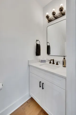 a spacious bedroom with a large bed and a flat screen tv