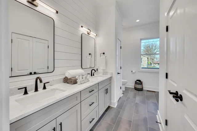 a bathroom with a glass shower door