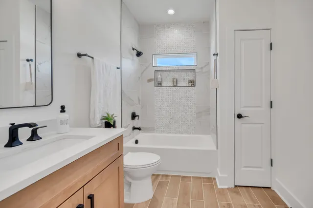 a bathroom with a bathtub and a sink