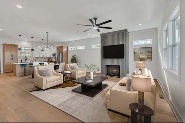 a living room with furniture fireplace and a flat screen tv