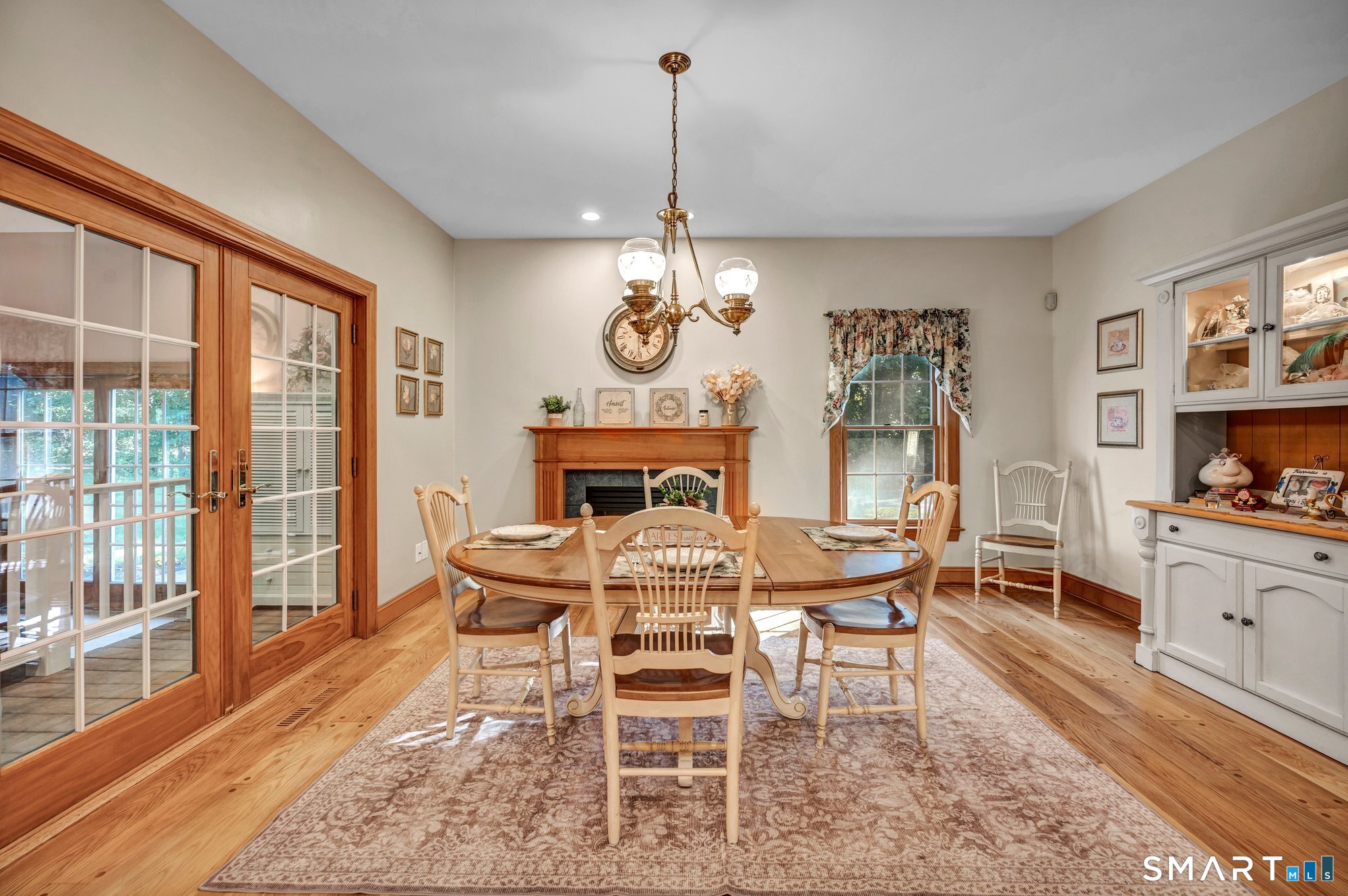 270 Copper Ridge Southington, CT 06489 - Photo 14 of 40 Spacious kitchen featuring a dining area, gas fireplace, refinished hardwood floors, and French doors leading to the indoor pool room.