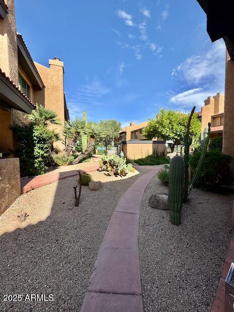 7432 Hum Road, Unit 203 Carefree, AZ 85377 - Photo 16 of 21 a view of a swimming pool with a patio