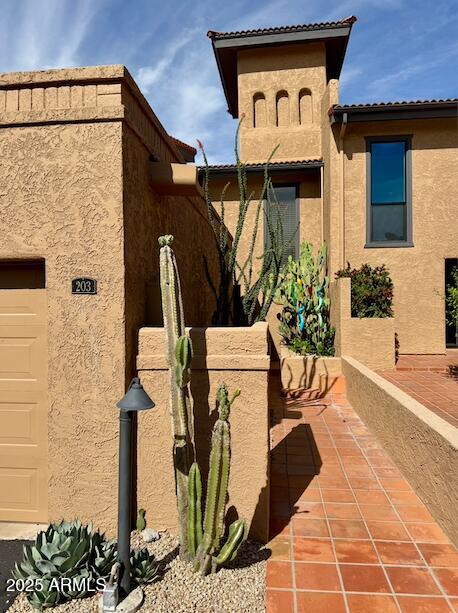 7432 Hum Road, Unit 203 Carefree, AZ 85377 - Photo 20 of 21 a front view of a house with a yard