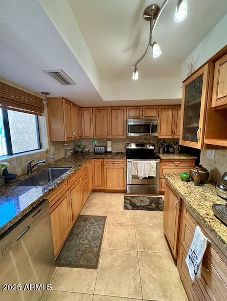 7432 Hum Road, Unit 203 Carefree, AZ 85377 - Photo 2 of 21 a large kitchen with stainless steel appliances granite countertop a stove granite counter tops and a view of living room