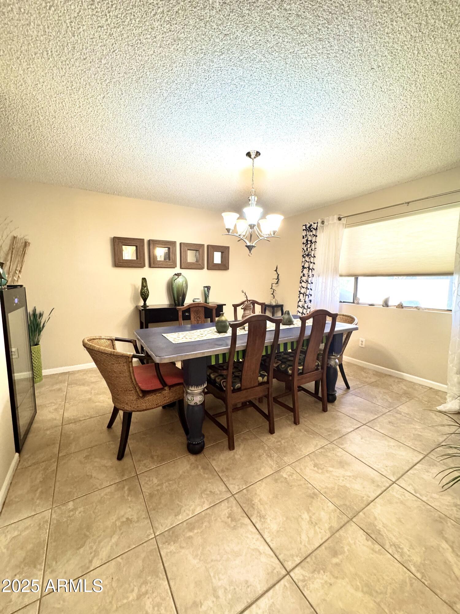 7432 Hum Road, Unit 203 Carefree, AZ 85377 - Photo 10 of 21 a view of a dining room with furniture