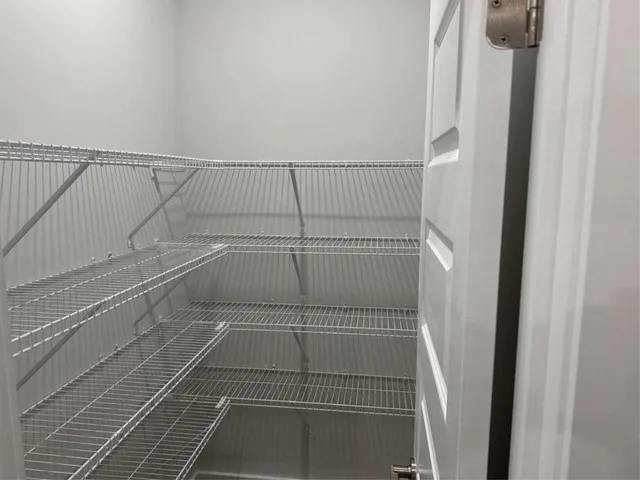 a view of a room with racks on the wall