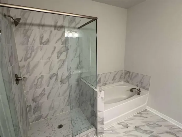 a white toilet sitting next to a sink