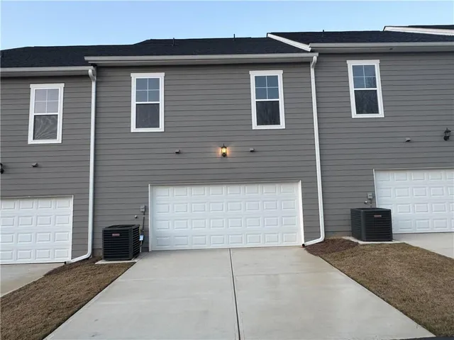 a view of multiple houses with a street