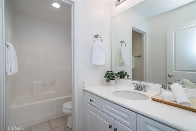 a view of a chairs and fire pit in the patio