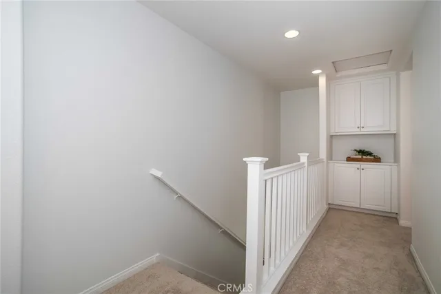 a view of a backyard with plants and a patio
