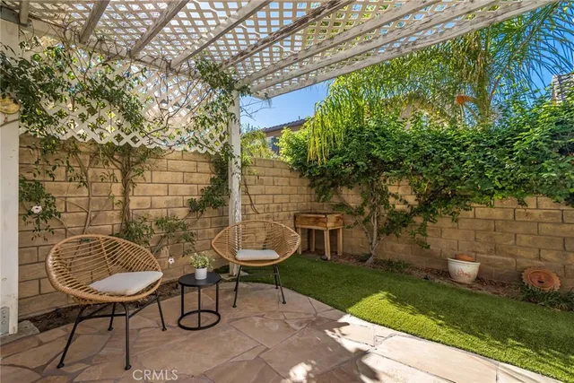 a view of a swimming pool with outdoor seating