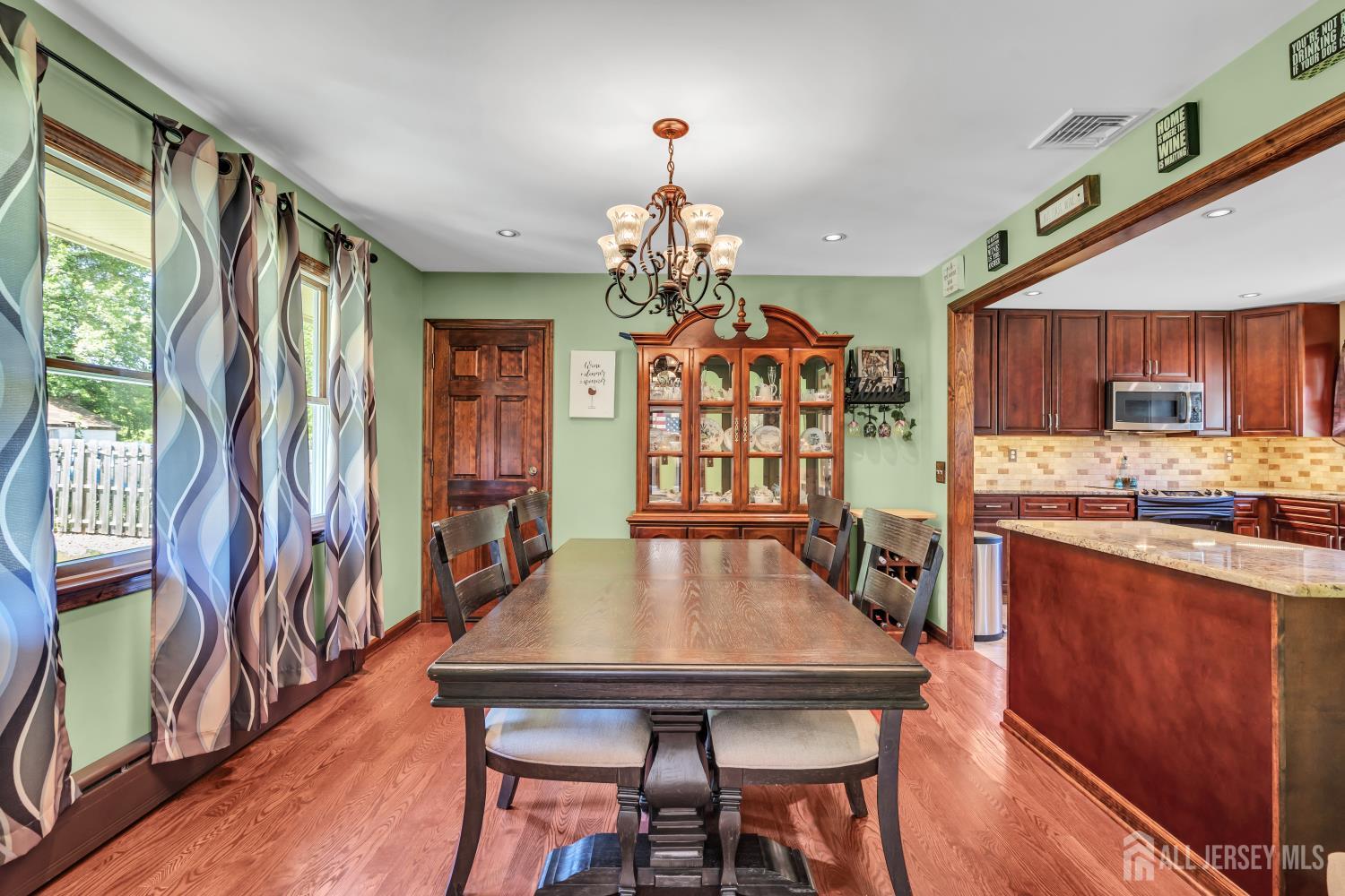 99 Schulmeister Road Old Bridge, NJ 08857 - Photo 9 of 49 a view of a dining room with furniture window and wooden floor