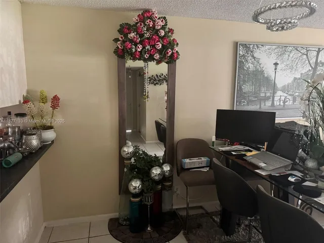 a kitchen with a sink and refrigerator