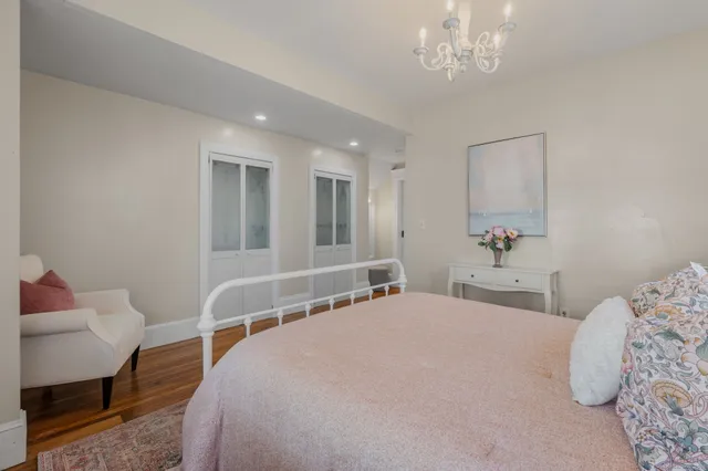 a bedroom with a bed and a chair