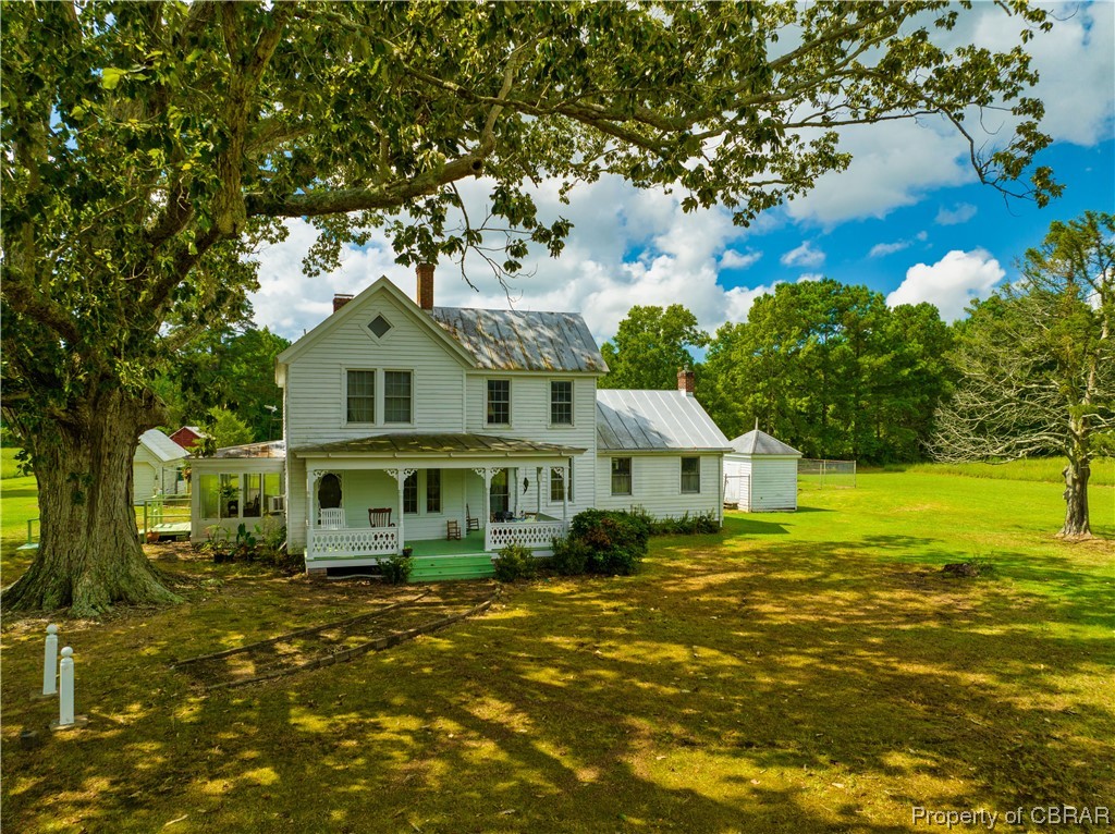 1502 Gdn Crk Road Mathews, VA 23109 - Photo 1 of 50 Farmhouse inspired home featuring a front yard, garage, and a porch