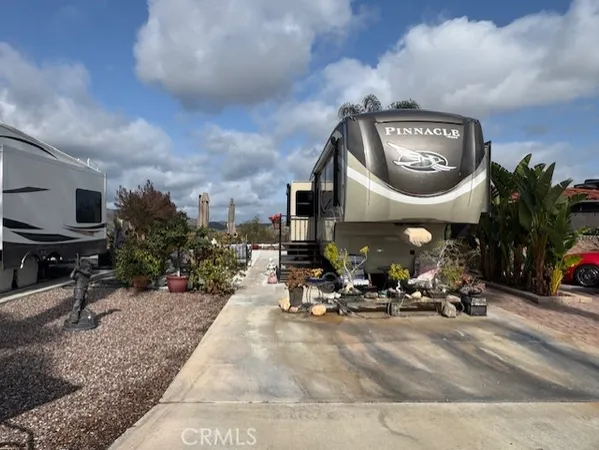 a view of a dinning room with furniture and a mirror