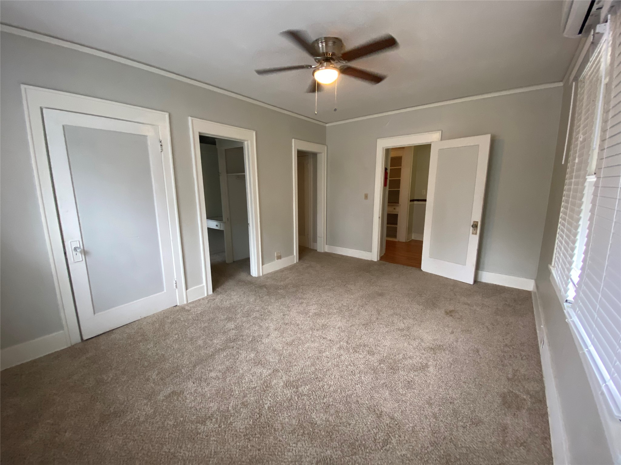 1414 Austin Street, Unit 6 Houston, TX 77002 - Photo 3 of 9 a view of a big room with closet and a ceiling fan