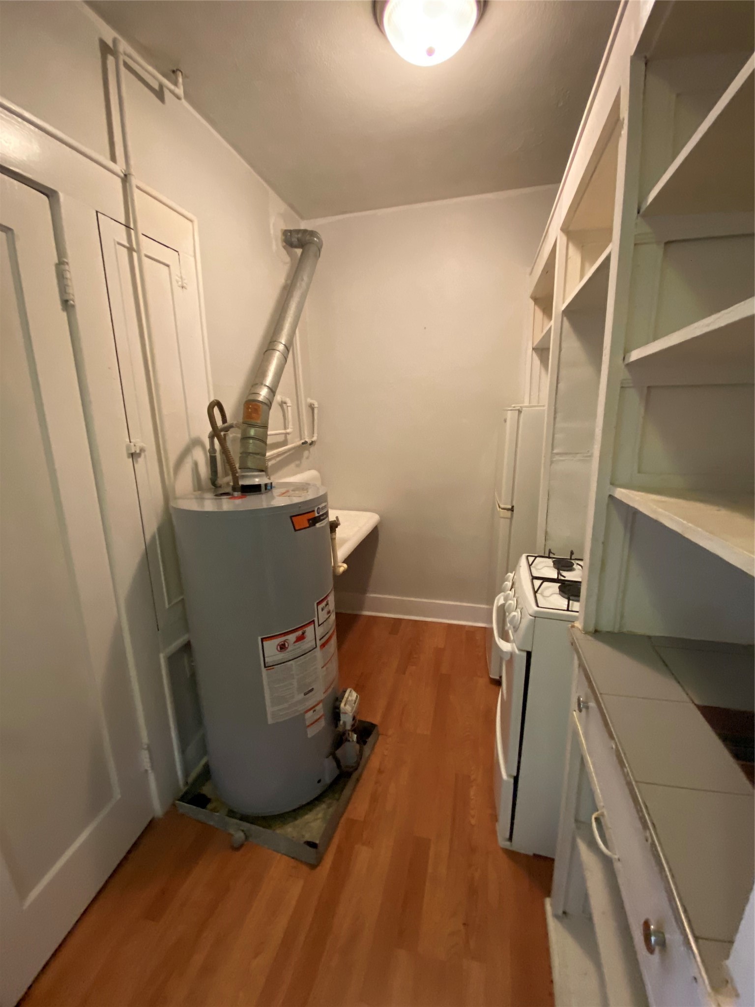 1414 Austin Street, Unit 6 Houston, TX 77002 - Photo 7 of 9 a view of a storage and utility room with empty racks