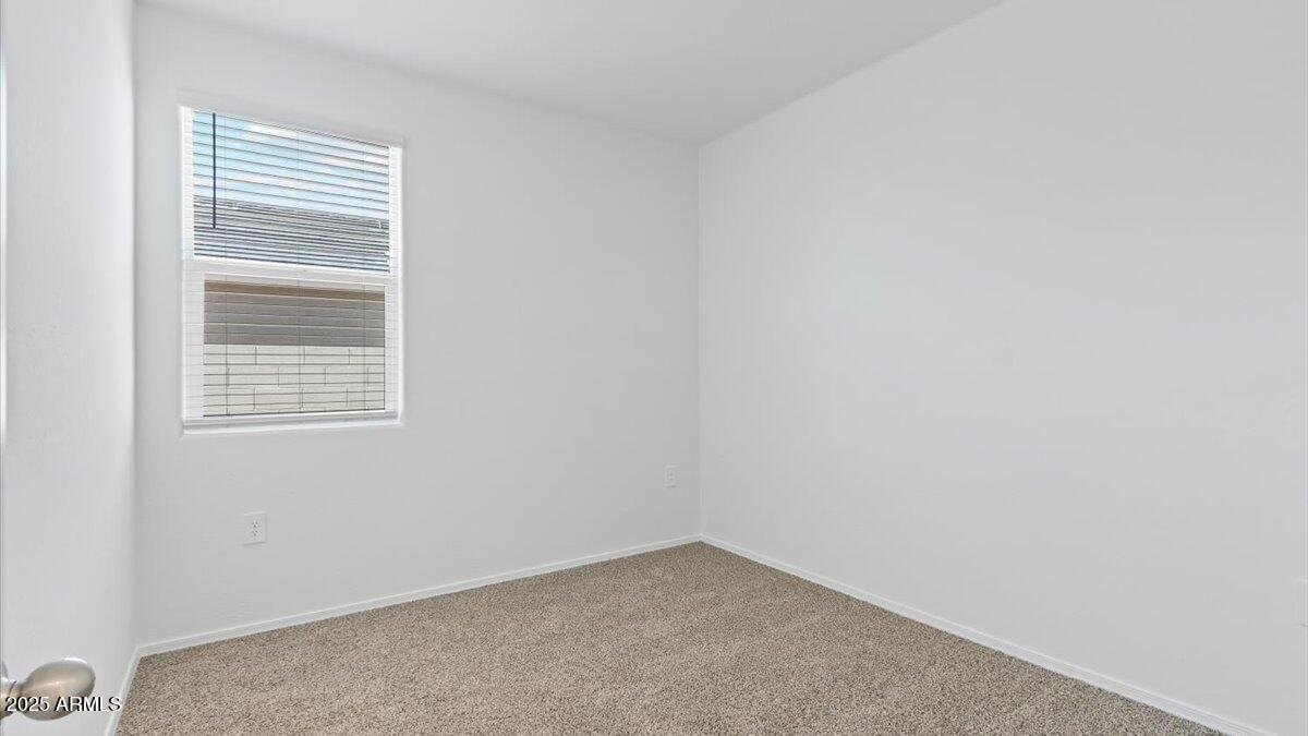 2032 Starkey Avenue Apache Junction, AZ 85120 - Photo 12 of 16 a view of an empty room with a window
