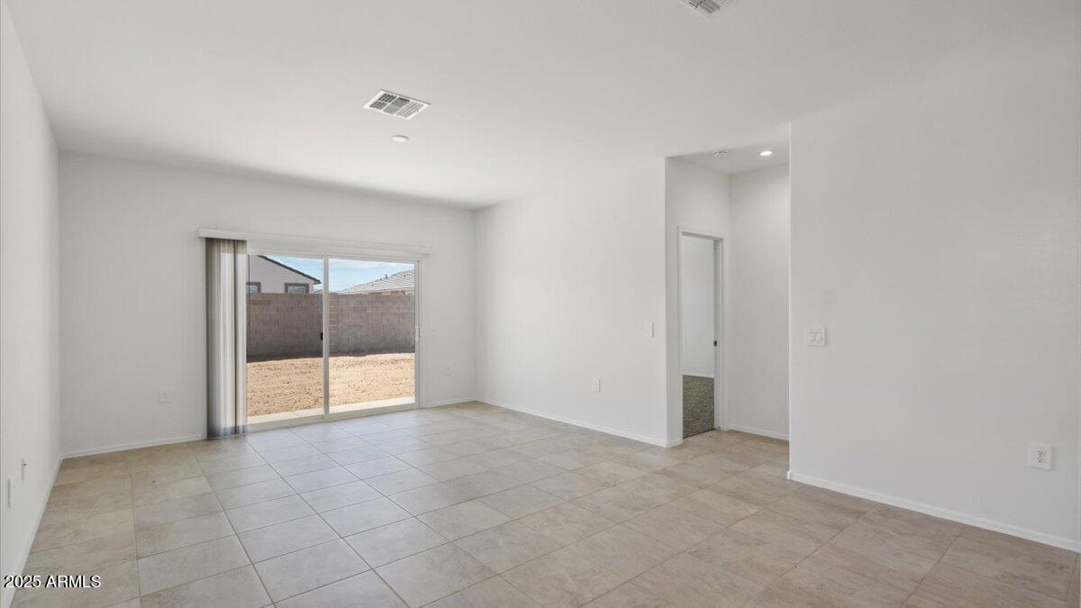 2032 Starkey Avenue Apache Junction, AZ 85120 - Photo 9 of 16 a view of an empty room with a window