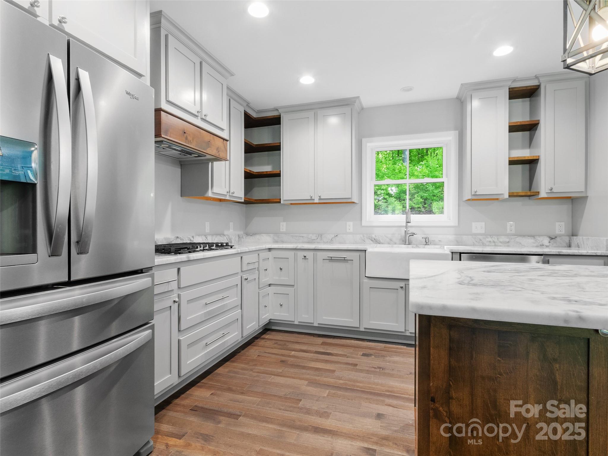 155 Pebble Ridge Road Spruce Pine, NC 28777 - Photo 11 of 39 a kitchen with stainless steel appliances granite countertop a stove a sink and a refrigerator
