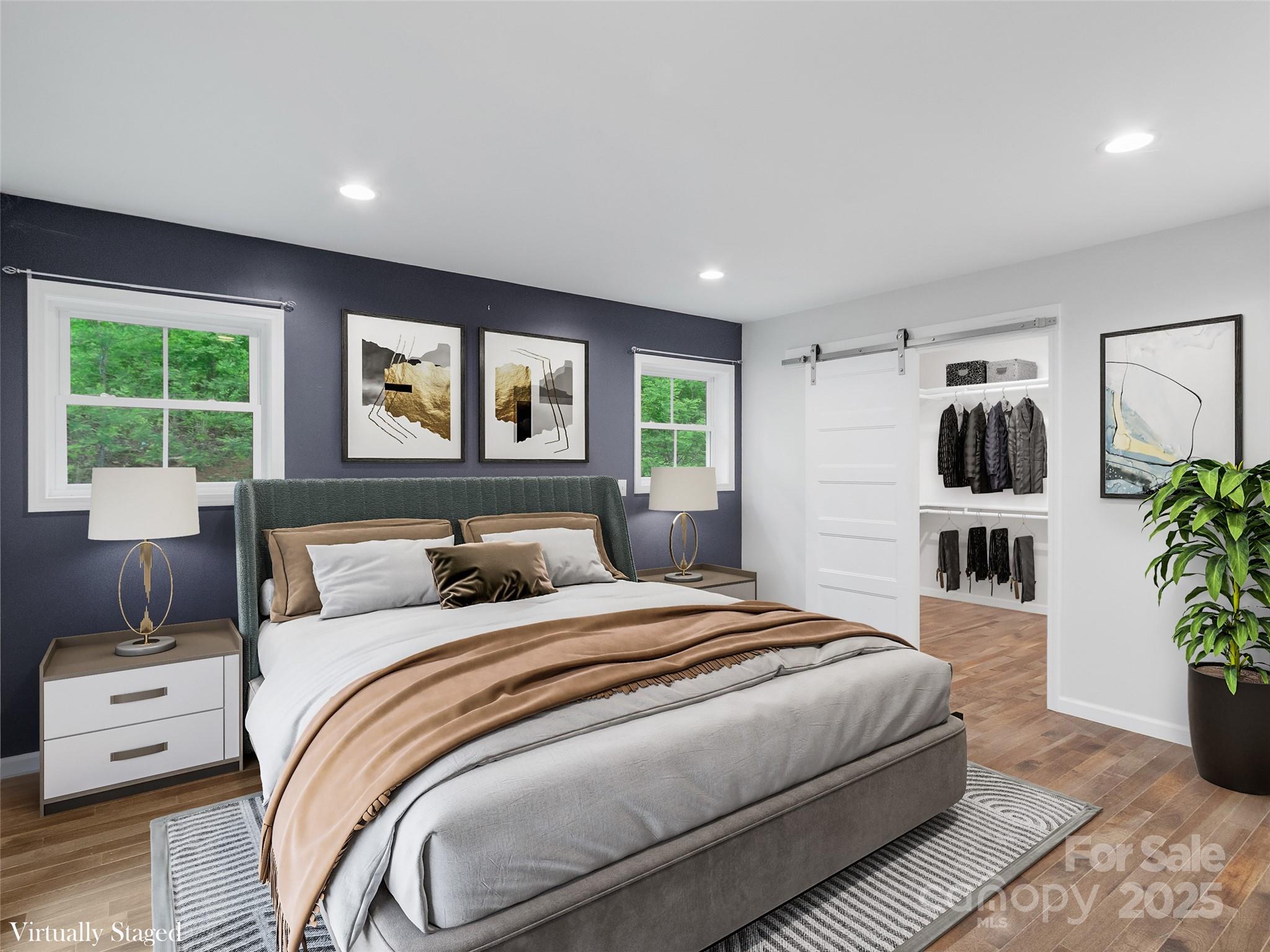 155 Pebble Ridge Road Spruce Pine, NC 28777 - Photo 14 of 39 a bedroom with a large bed and a large window