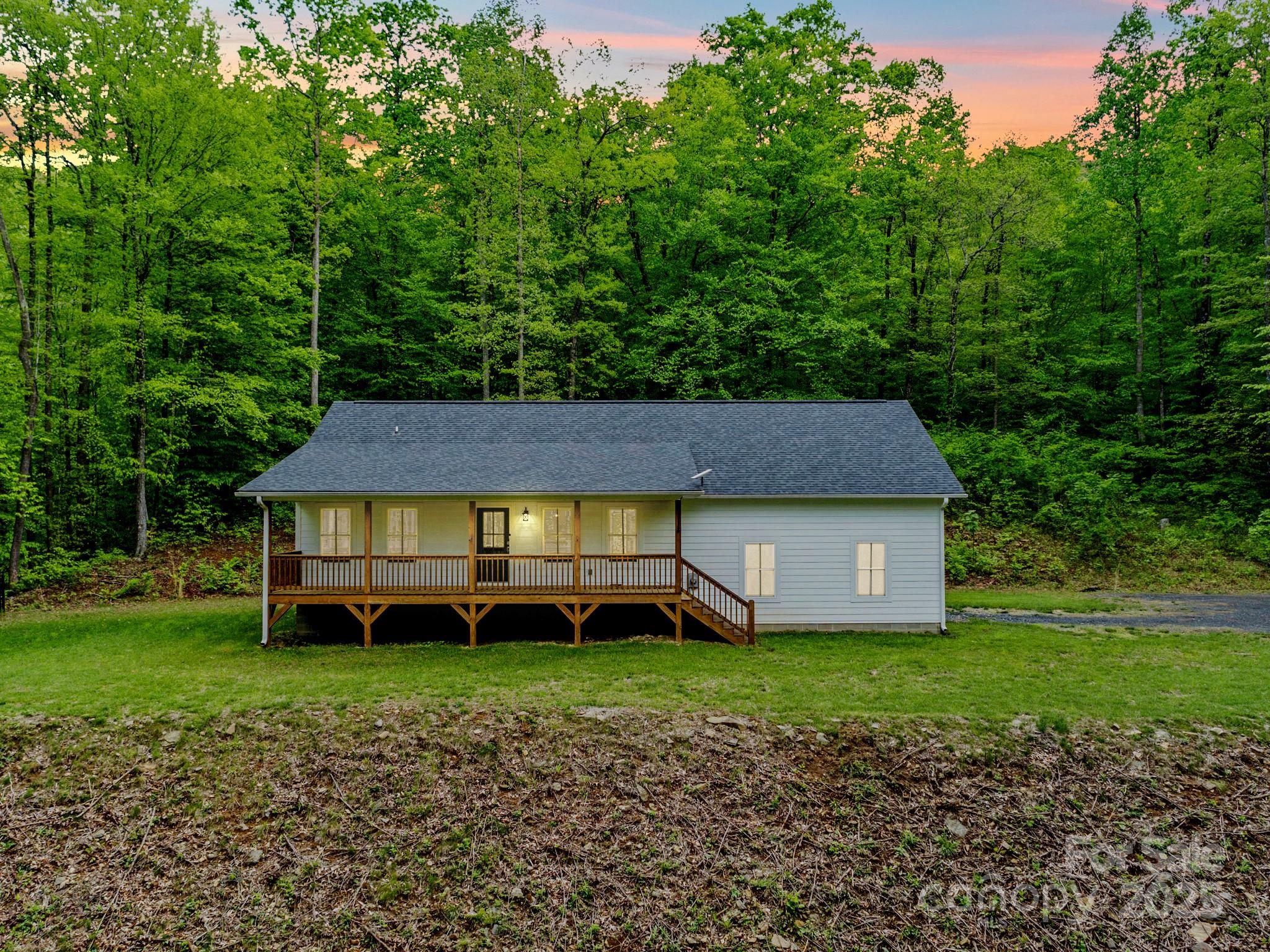 155 Pebble Ridge Road Spruce Pine, NC 28777 - Photo 2 of 39 a view of a house with a yard