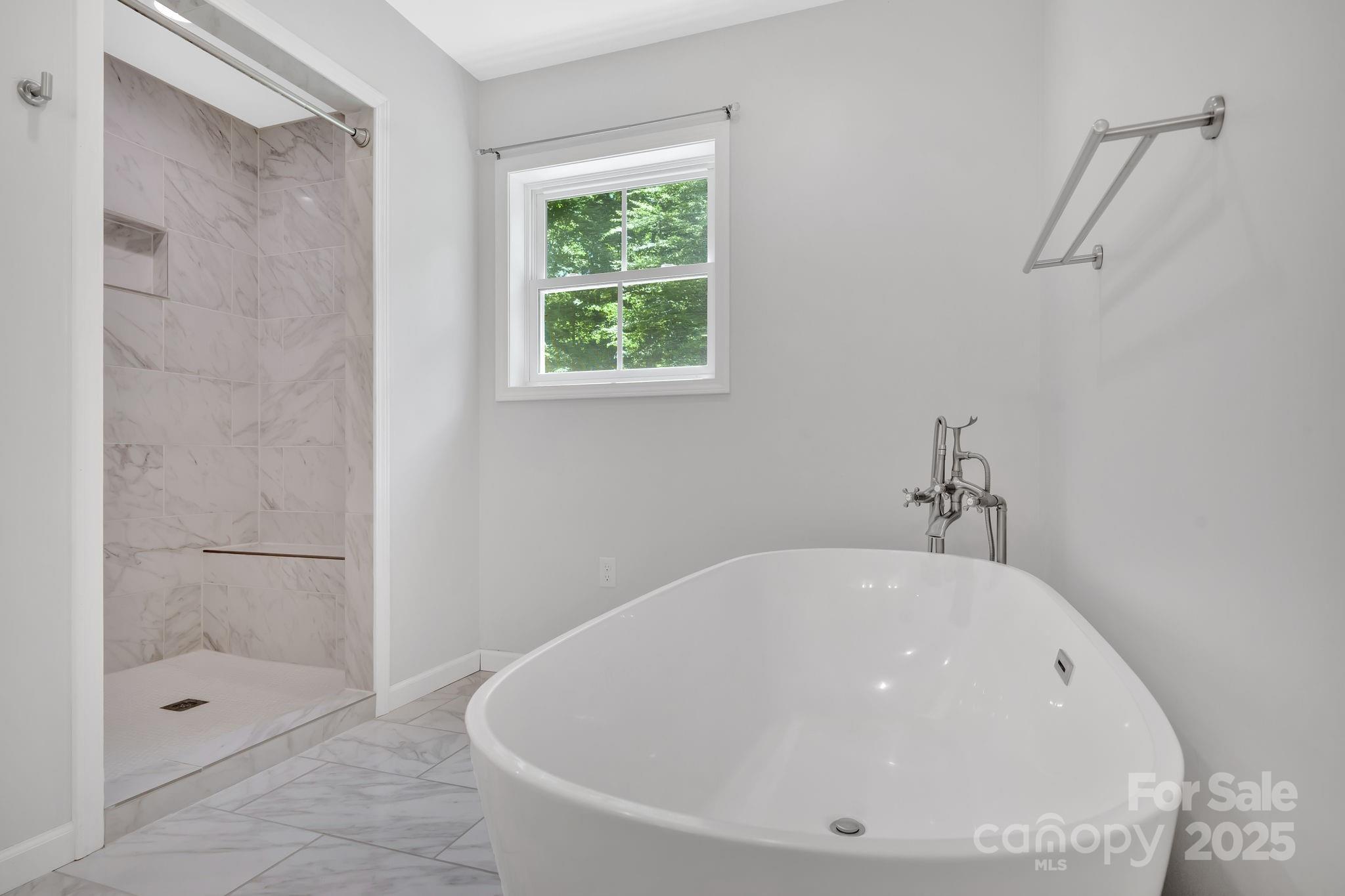 155 Pebble Ridge Road Spruce Pine, NC 28777 - Photo 21 of 39 a white bath tub sitting next to a shower