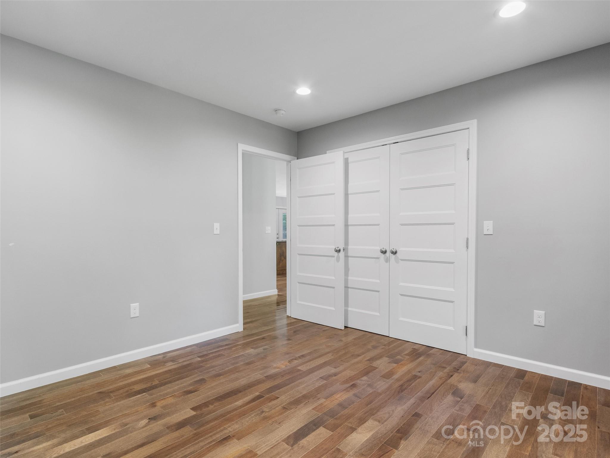 155 Pebble Ridge Road Spruce Pine, NC 28777 - Photo 23 of 39 a view of an empty room and wooden floor