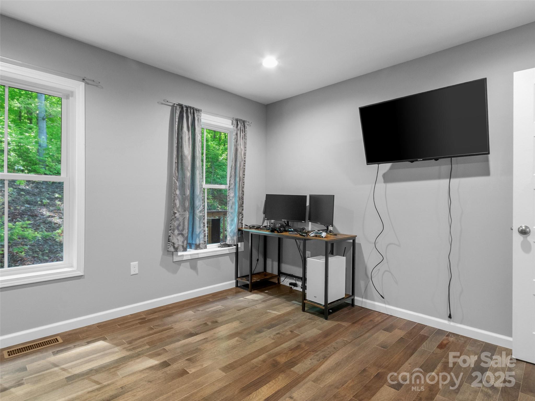 155 Pebble Ridge Road Spruce Pine, NC 28777 - Photo 25 of 39 a view of a livingroom with furniture and a flat screen tv